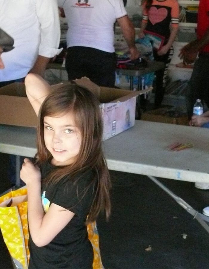 Girl Receives Backback Supplies